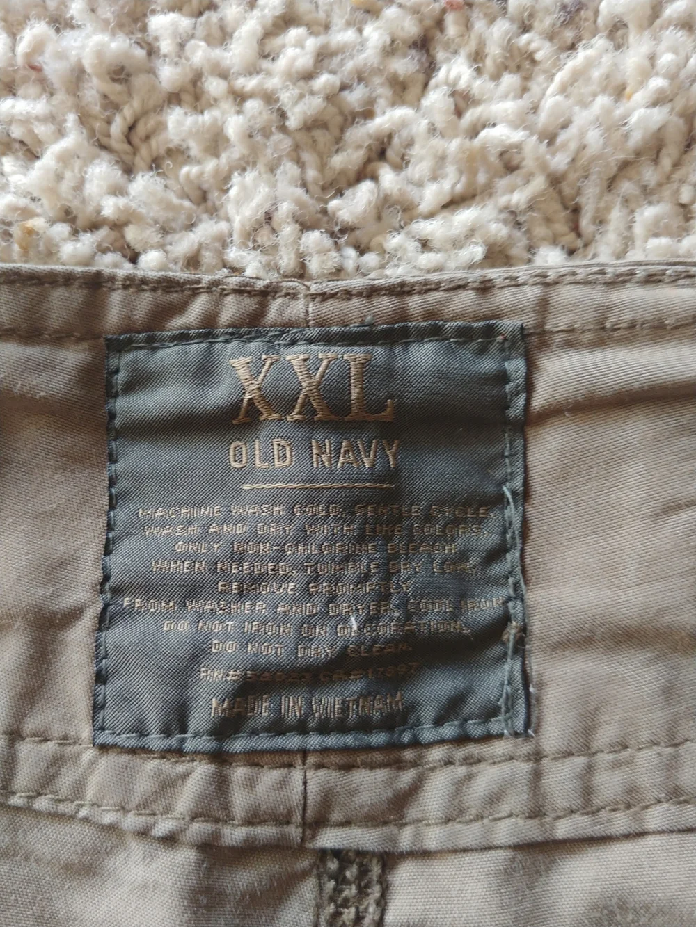 Old Navy Tan Hybrid Shorts with Orange Skull Accent